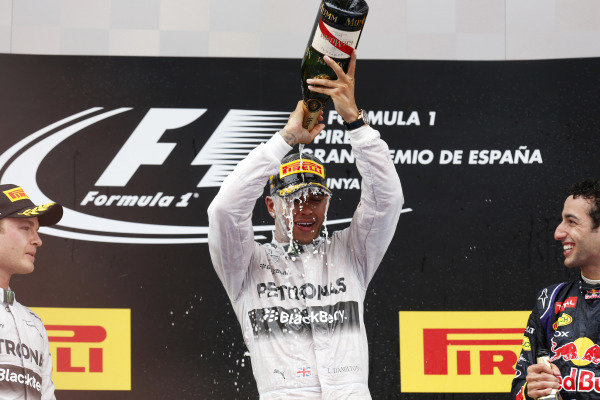 Circuit de Catalunya, Barcelona, Spain.
Sunday 11 May 2014.
Lewis Hamilton, Mercedes AMG, 1st Position, pours Champagne on his head as Nico Rosberg, Mercedes AMG, 2nd Position, and Daniel Ricciardo, Red Bull Racing, 3rd Position, look on.
World Copyright: Alastair Staley/LAT Photographic.
ref: Digital Image _79P1869