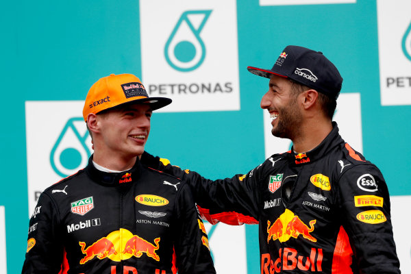 Sepang International Circuit, Sepang, Malaysia.
Sunday 1 October 2017.
Max Verstappen, Red Bull, 1st Position, and Daniel Ricciardo, Red Bull Racing, 3rd Position, on the podium.
World Copyright: Glenn Dunbar/LAT Images 
ref: Digital Image _X4I4007