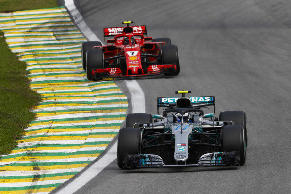 Valtteri Bottas, Mercedes AMG F1 W09, leads Kimi Raikkonen, Ferrari SF71H.