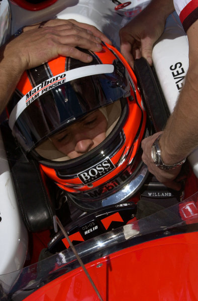 Bombardier ATV Copper World INDY 200, Phoenix International Raceway, Phoenix, Arizona, USA 17 March,2002 The Team Penske crew "inserts" Helio Castroneves into the cockpit of his car.
Copyright-F
Peirce Williams 2002 LAT PHOTOGRAPHIC

