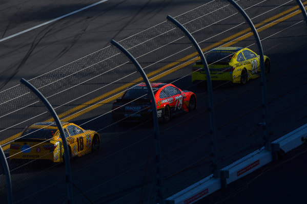 13-21 February, 2016, Daytona Beach, Florida USA
Matt Kenseth, Dollar General Toyota Camry, Martin Truex Jr, Furniture Row Toyota Camry, and Kyle Busch, M&M's 75 Toyota Camry speed to turn one as the west side of the track falls into shadow in the closing laps.
?2016, F. Peirce Williams
LAT Photo USA