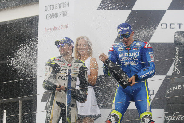 2016 MotoGP Championship.
British Grand Prix.
Silverstone, England. 2nd - 4th September 2016.
Maverick Vinales, Suzuki, celebrates his first MotoGP win on the podium alongside Cal Crutchlow, LCR Honda.
Ref: _W7_9526a. World copyright: Kevin Wood/LAT Photographic 2016 MotoGP Championship.
British Grand Prix.
Silverstone, England. 2nd - 4th September 2016.
Maverick Vinales, Suzuki, celebrates his first MotoGP win on the podium alongside Cal Crutchlow, LCR Honda.
Ref: _W7_9526a. World copyright: Kevin Wood/LAT Photographic