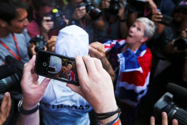 Autodromo Hermanos Rodriguez, Mexico City, Mexico.
Sunday 29 October 2017.
Lewis Hamilton, Mercedes AMG, celebrates with his mum Carmen Larbalestier, surrounded by photographers and media,after securing his 4th world drivers championship title, and third with Mercedes.
World Copyright: Charles Coates/LAT Images
ref: Digital Image DJ5R7937 Autodromo Hermanos Rodriguez, Mexico City, Mexico.
Sunday 29 October 2017.
Lewis Hamilton, Mercedes AMG, celebrates with his mum Carmen Larbalestier, surrounded by photographers and media,after securing his 4th world drivers championship title, and third with Mercedes.
World Copyright: Charles Coates/LAT Images
ref: Digital Image DJ5R7937