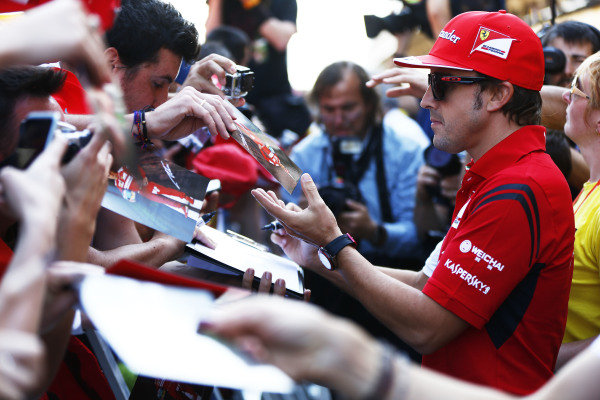 Circuit de Catalunya, Barcelona, Spain.
Thursday 8 May 2014.
Fernando Alonso, Ferrari, signs autographs for fans.
World Copyright: Andy Hone/LAT Photographic.
ref: Digital Image _ONY7764 Circuit de Catalunya, Barcelona, Spain.
Thursday 8 May 2014.
Fernando Alonso, Ferrari, signs autographs for fans.
World Copyright: Andy Hone/LAT Photographic.
ref: Digital Image _ONY7764