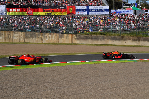 Kimi Raikkonen, Ferrari SF71H and Max Verstappen, Red Bull Racing RB14
