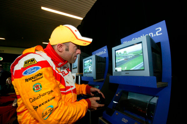 2003 Australian V8 Supercars, Round 9, Sandown, 14th September 2003.
David Brabham tries his hand on the PS2 during the Betta Electrical 500 held at Sandown International Raceway Melbourne, Australia this weekend.
Photo: Mark Horsburgh/LAT Photographic 2003 Australian V8 Supercars, Round 9, Sandown, 14th September 2003.
David Brabham tries his hand on the PS2 during the Betta Electrical 500 held at Sandown International Raceway Melbourne, Australia this weekend.
Photo: Mark Horsburgh/LAT Photographic