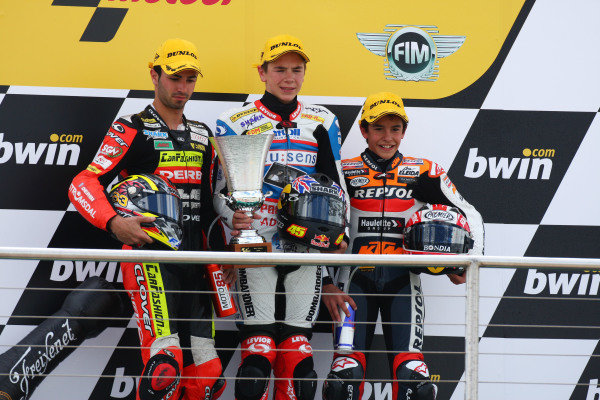 Donington Park, England. 20th-22nd June 2008. 
125cc. 
Mike Di Meglio, 2nd position, Scott Redding, 1st position, and Marc Marquez, 3rd position, on the podium. 
Ref: IMG_6279a. World Copyright: Kevin Wood/LAT Photographic