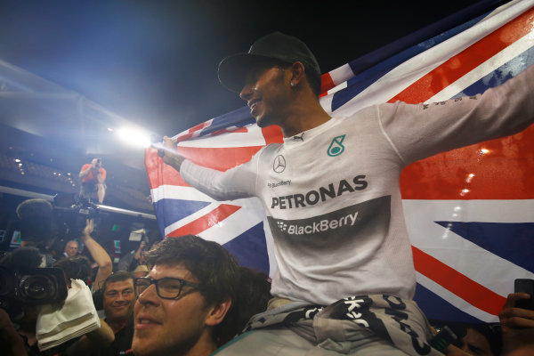 Yas Marina Circuit, Abu Dhabi, United Arab Emirates.
Sunday 23 November 2014.
Lewis Hamilton, Mercedes AMG, 1st Position, celebrates 2014 title success with his team.
World Copyright: Andy Hone/LAT Photographic.
ref: Digital Image _ONY2538 Yas Marina Circuit, Abu Dhabi, United Arab Emirates.
Sunday 23 November 2014.
Lewis Hamilton, Mercedes AMG, 1st Position, celebrates 2014 title success with his team.
World Copyright: Andy Hone/LAT Photographic.
ref: Digital Image _ONY2538