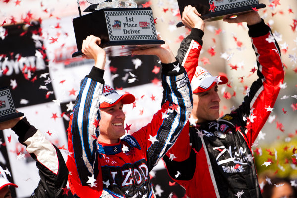 Long Beach. California, USA. 16th - 18th April 2010. 
Ryan Hunter - Reay, (Andretti Autosport) celebrates victory on the podium with Justin Wilson, (Dreyer and Reinbold Racing) and Will Power, (Verizon Team Penske). 
Portrait.  
World Copyright: Drew Gibson/LAT Photographic. 
Digital Image _Y2Z2559