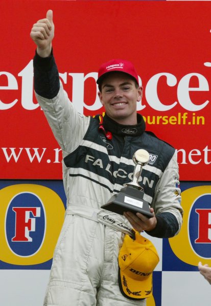 2002 Australian V8 Supercar race.
Melbourne, Australia. 3rd March 2002.
V8 Supercar 2002 AGP : Ford driver Craig Lowndes on the Podium after winning the third and final race for the V8 Supercars at the 2002 Fosters Australian GP.
World Copyright - Horsburgh/LAT Photographic 2002 Australian V8 Supercar race.
Melbourne, Australia. 3rd March 2002.
V8 Supercar 2002 AGP : Ford driver Craig Lowndes on the Podium after winning the third and final race for the V8 Supercars at the 2002 Fosters Australian GP.
World Copyright - Horsburgh/LAT Photographic