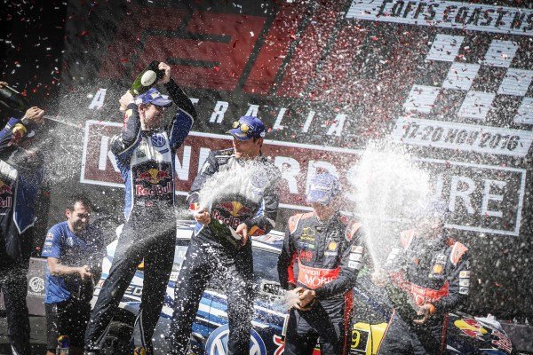 Rally winners Andreas Mikkelsen (NOR) / Anders Jaeger Synnevag (NOR), Volkswagen Motorsport II WRC and third placed Thierry Neuville (BEL) / Nicolas Gilsoul (BEL), Hyundai Motorsport N WRC celebrate on the podium with the champagne at FIA World Rally Championship, Rd13, Rally Australia, Day Three, Coffs Harbour, New South Wales, Australia, 20 November 2016.