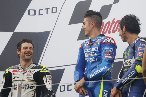 2016 MotoGP Championship. 
British Grand Prix. 
Silverstone, England. 2nd - 4th September 2016. 
Maverick Vinales, Suzuki, Cal Crutchlow, LCR Honda, and Valentino Rossi, Yamaha, celebrate on the podium. 
Ref: _W7_9508a. World copyright: Kevin Wood/LAT Photographic