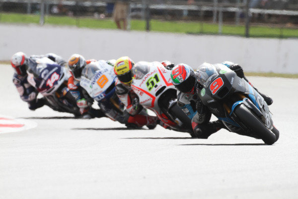 British Grand Prix. 
Silverstone, England. 30th August - 1st September 2013. 
Danilo Petrucci, Ioda Suter, leads Michele Pirro, Pramac Ducati, Hector Barbera, Avintia Blusens FTR, and Randy De Puniet, Aspar ART. 
Ref: IMG_2005a. World copyright: Kevin Wood/LAT Photographic