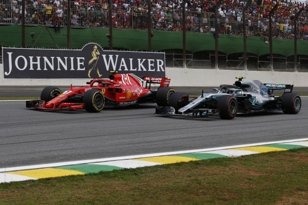Kimi Raikkonen, Ferrari SF71H and Valtteri Bottas, Mercedes-AMG F1 W09 EQ Power+ battle