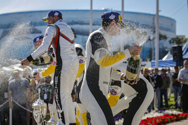 #4 Corvette Racing Corvette C7.R, GTLM: Oliver Gavin, Tommy Milner, #912 Porsche GT Team Porsche 911 RSR, GTLM: Earl Bamber, Laurens Vanthoor, #3 Corvette Racing Corvette C7.R, GTLM: Jan Magnussen, Antonio Garcia celebrate on the podium with champagne